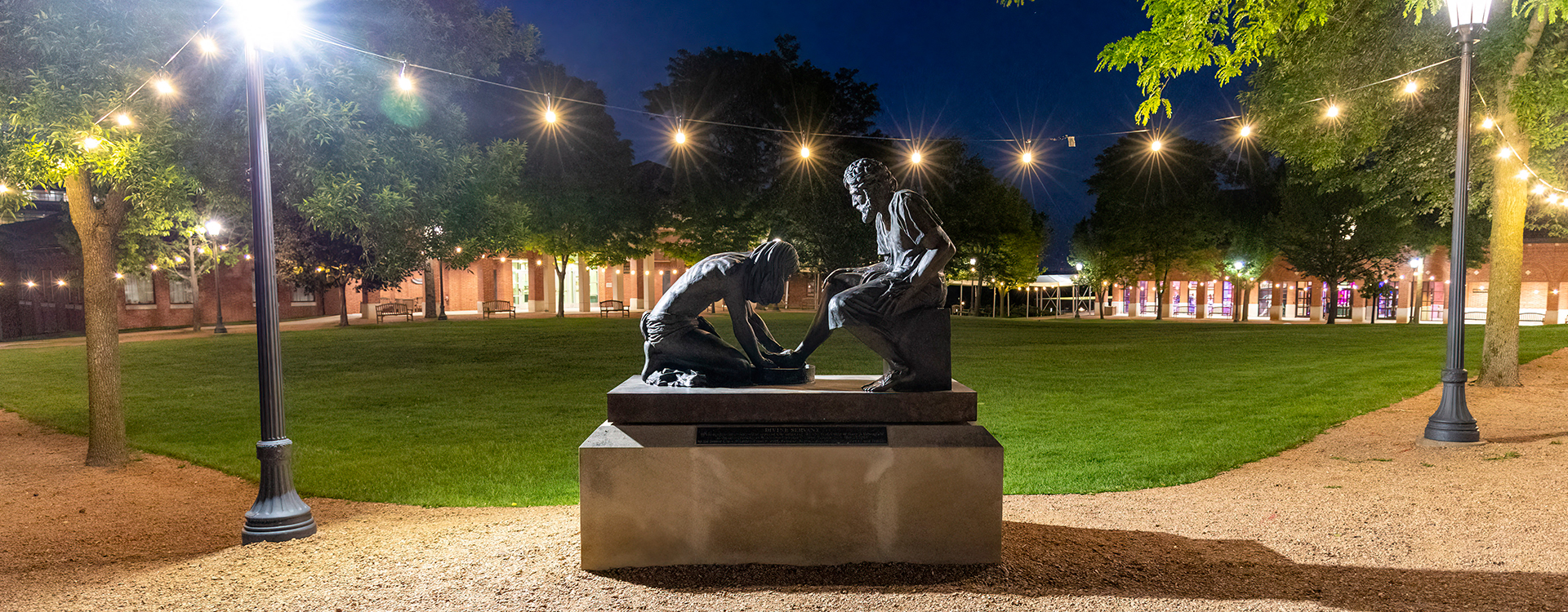 Divine Servant Statue at night